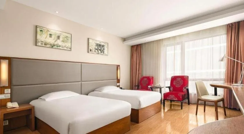 Bed in Warmly Hotel Suzhou Shuanghuwan