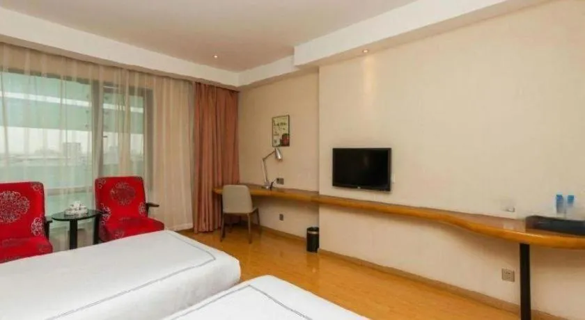 Bed in Warmly Hotel Suzhou Shuanghuwan