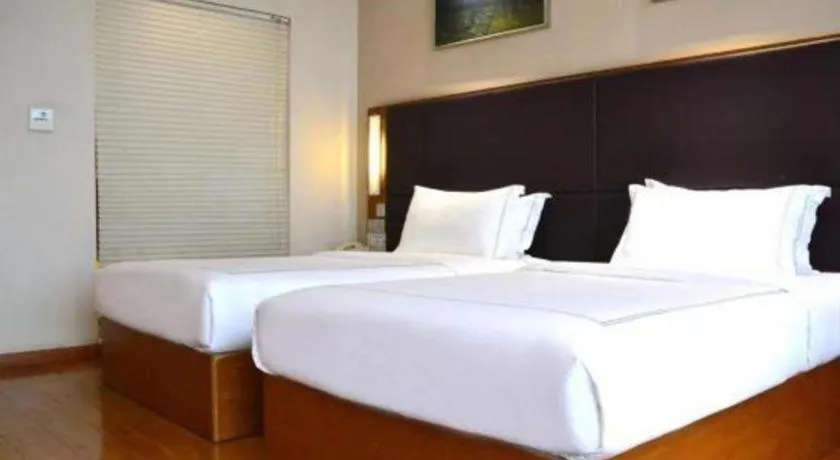 Bed in Warmly Hotel Suzhou Shuanghuwan