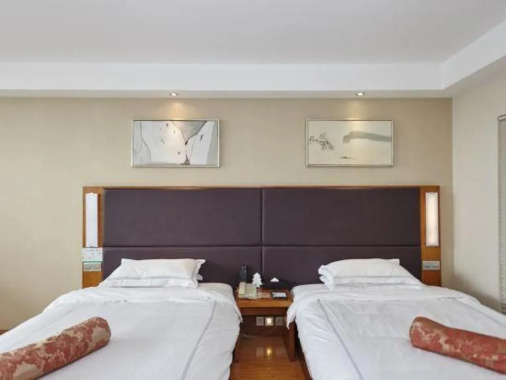 Bed in Warmly Hotel Suzhou Shuanghuwan