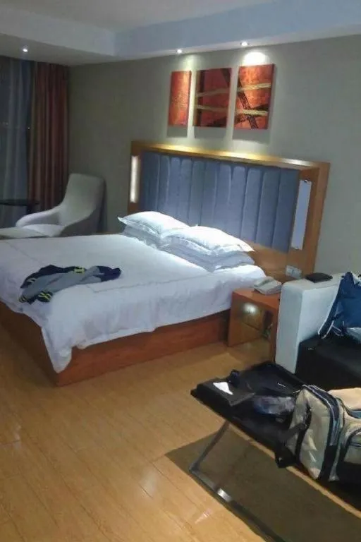 Bed in Warmly Hotel Suzhou Shuanghuwan