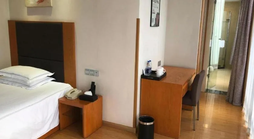 Bed in Warmly Hotel Suzhou Shuanghuwan