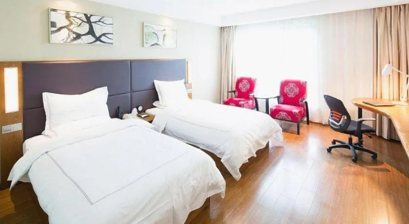 Bed in Warmly Hotel Suzhou Shuanghuwan