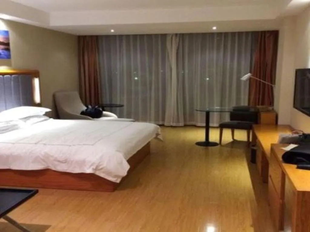 Bed in Warmly Hotel Suzhou Shuanghuwan