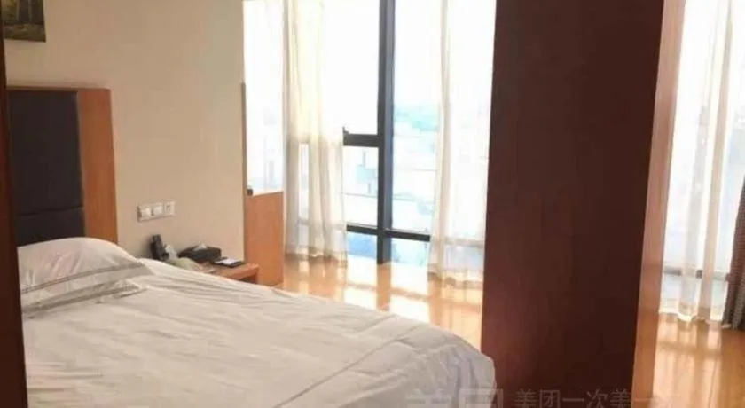 Bed in Warmly Hotel Suzhou Shuanghuwan