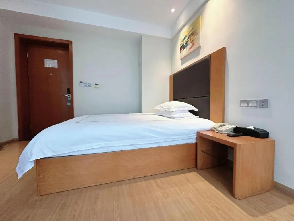 Bed in Warmly Hotel Suzhou Shuanghuwan