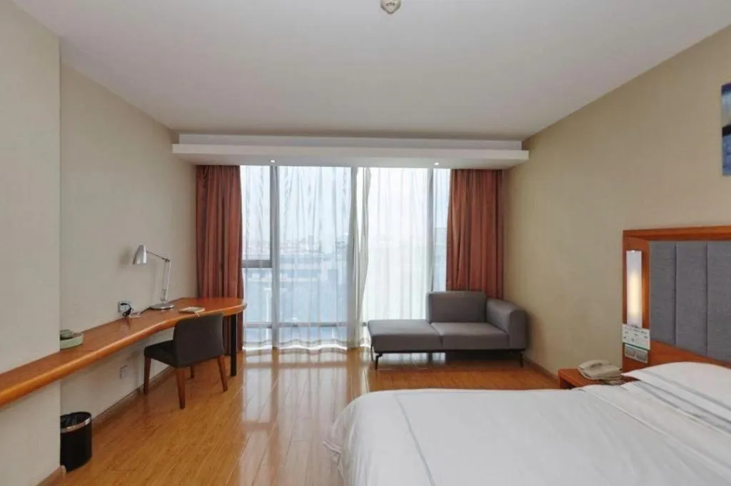 Bed in Warmly Hotel Suzhou Shuanghuwan