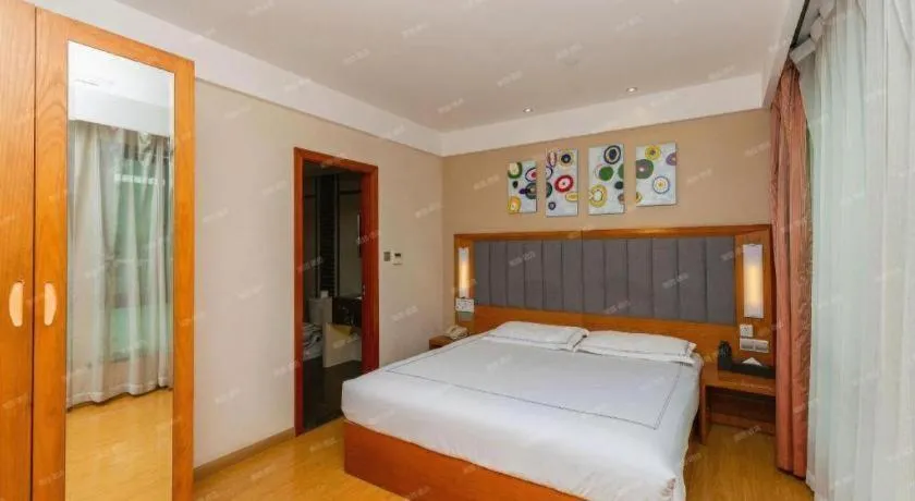 Bed in Warmly Hotel Suzhou Shuanghuwan