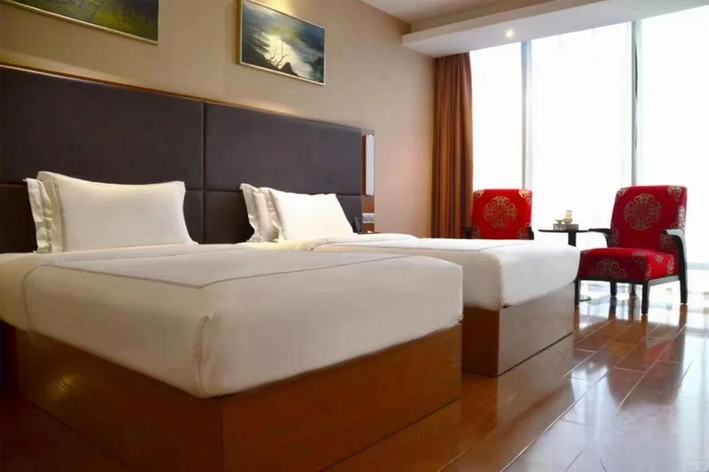 Bed in Warmly Hotel Suzhou Shuanghuwan