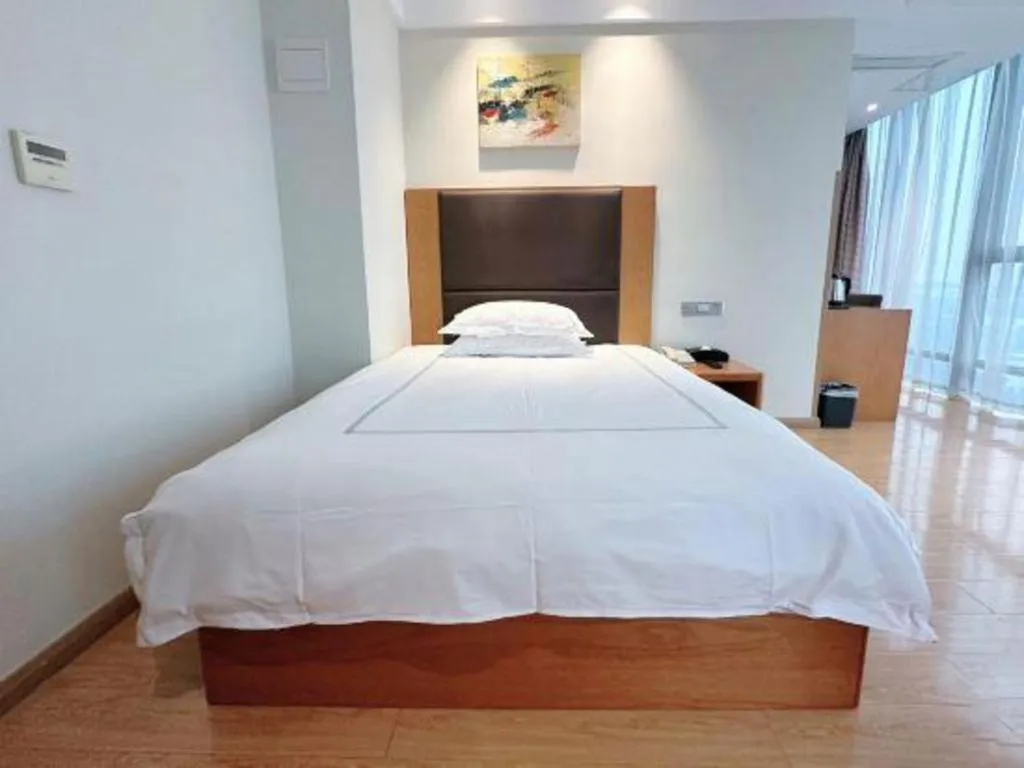 Bed in Warmly Hotel Suzhou Shuanghuwan