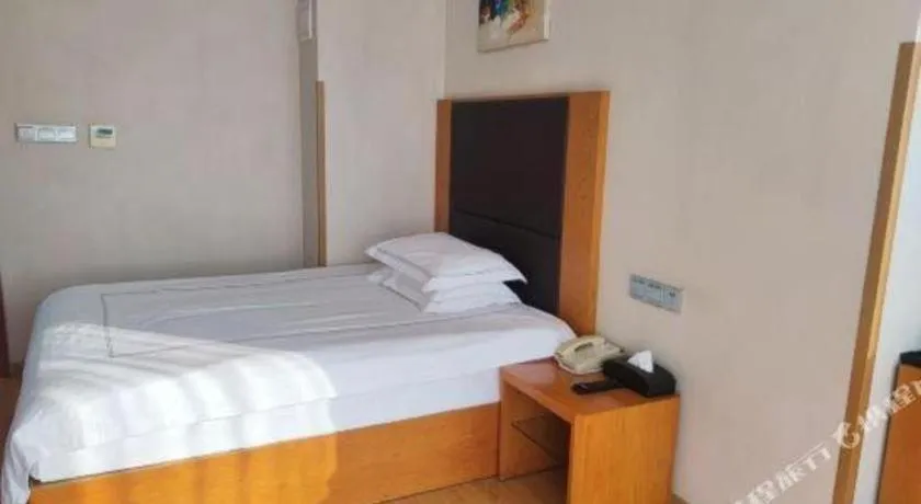 Bed in Warmly Hotel Suzhou Shuanghuwan