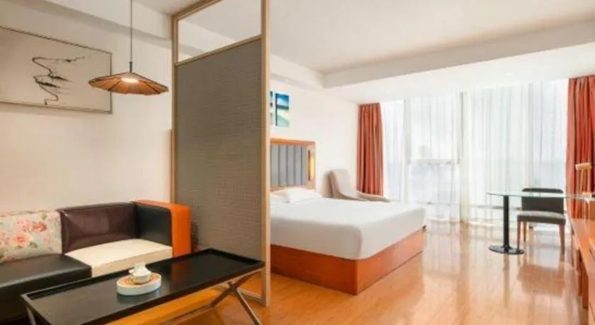 Bed in Warmly Hotel Suzhou Shuanghuwan