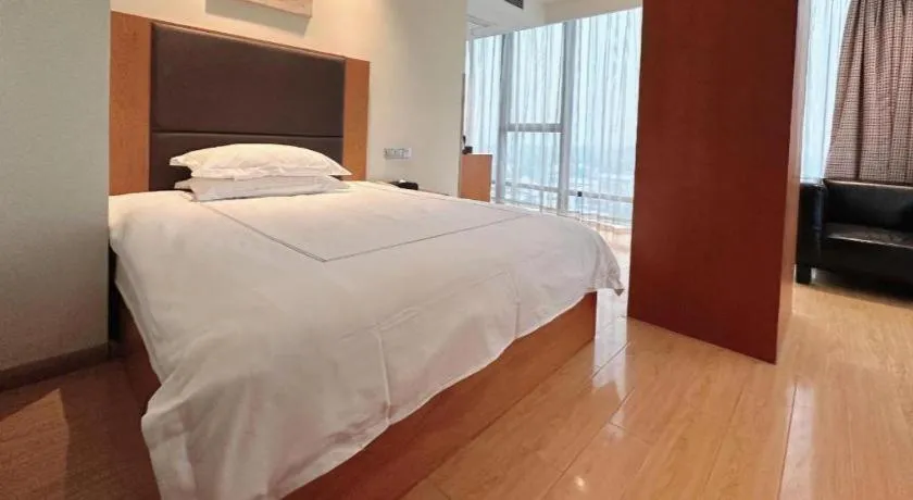 Bed in Warmly Hotel Suzhou Shuanghuwan