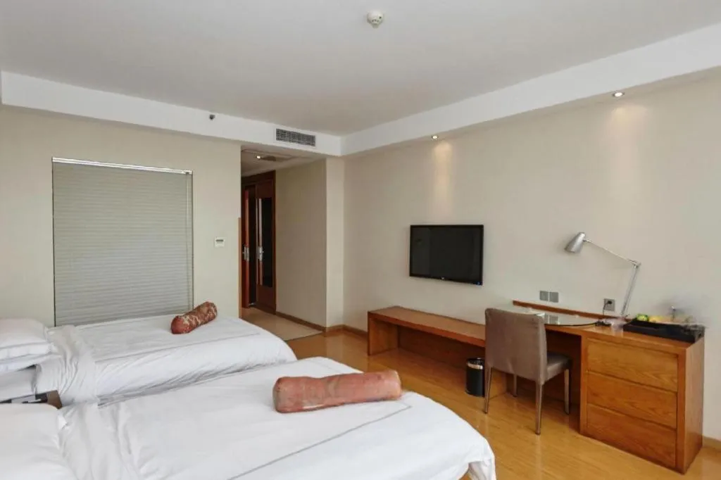 Bed in Warmly Hotel Suzhou Shuanghuwan