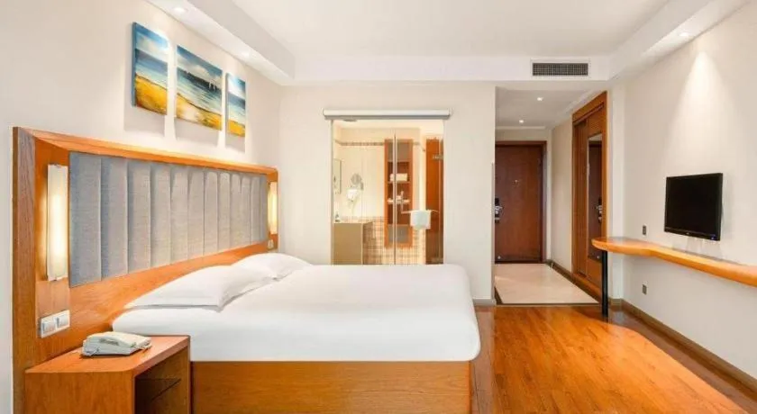 Bed in Warmly Hotel Suzhou Shuanghuwan