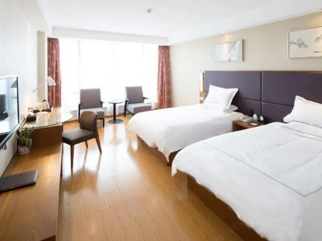 Bed in Warmly Hotel Suzhou Shuanghuwan