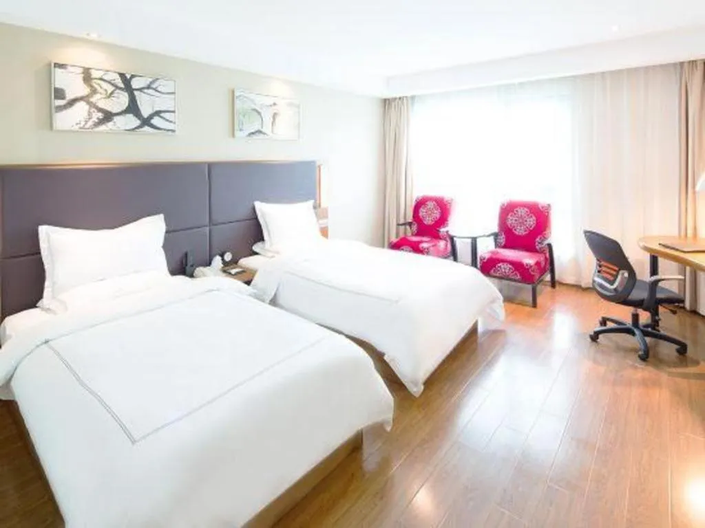 Bed in Warmly Hotel Suzhou Shuanghuwan