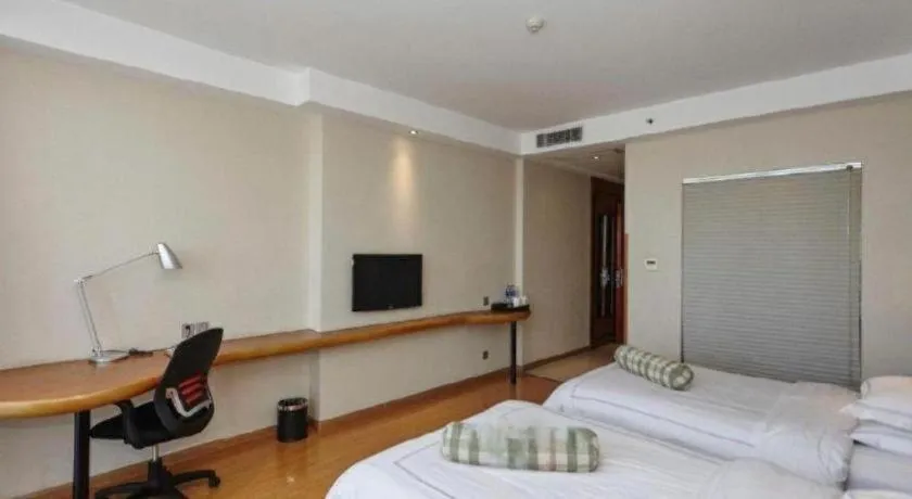 Bed in Warmly Hotel Suzhou Shuanghuwan