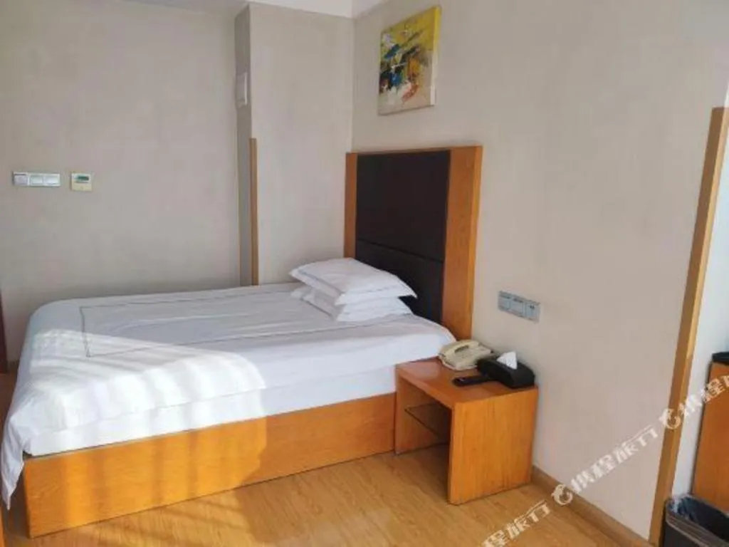 Bed in Warmly Hotel Suzhou Shuanghuwan