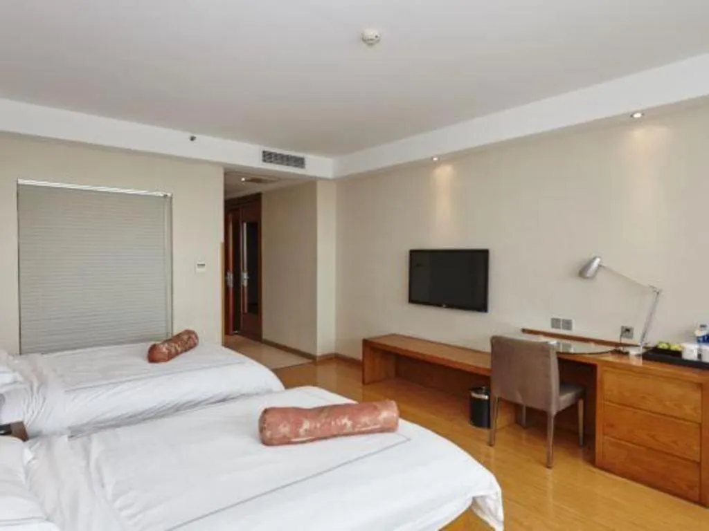 Bed in Warmly Hotel Suzhou Shuanghuwan