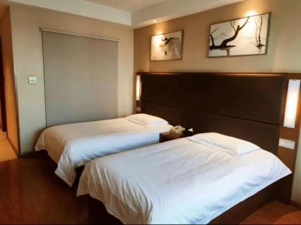 Bed in Warmly Hotel Suzhou Shuanghuwan