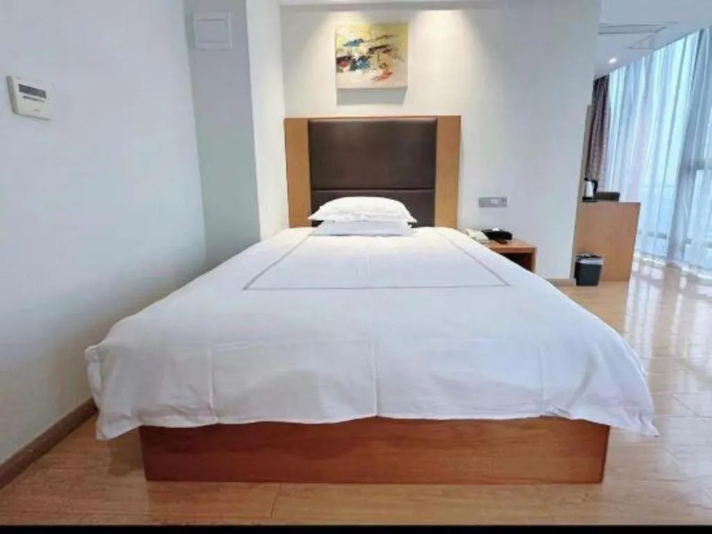 Bed in Warmly Hotel Suzhou Shuanghuwan