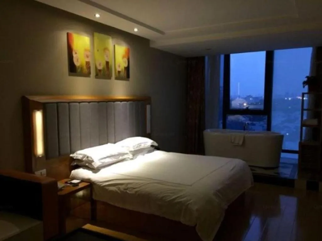 Bed in Warmly Hotel Suzhou Shuanghuwan