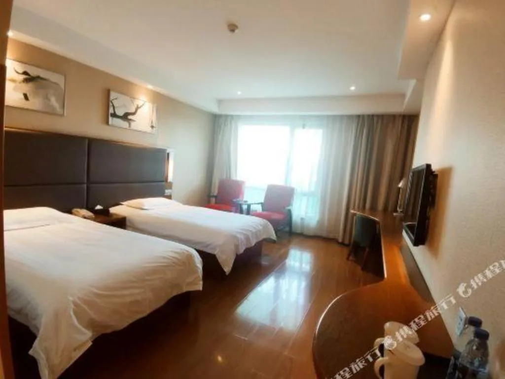 Bed in Warmly Hotel Suzhou Shuanghuwan