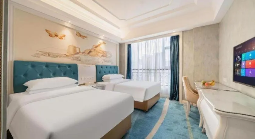 Bed in Vienna Hotel Guiyang Jiaxiulou Jichang Road