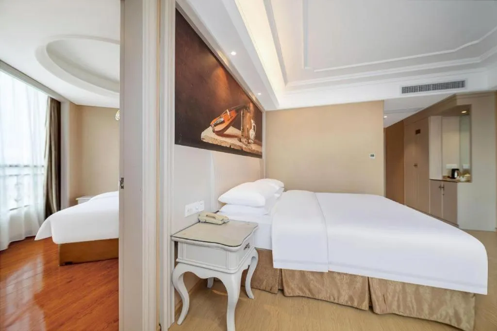 Bed in Vienna Hotel Guiyang Jiaxiulou Jichang Road