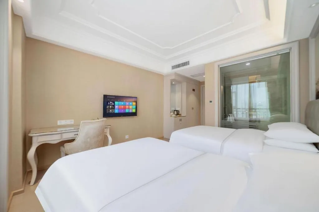 Bed in Vienna Hotel Guiyang Jiaxiulou Jichang Road