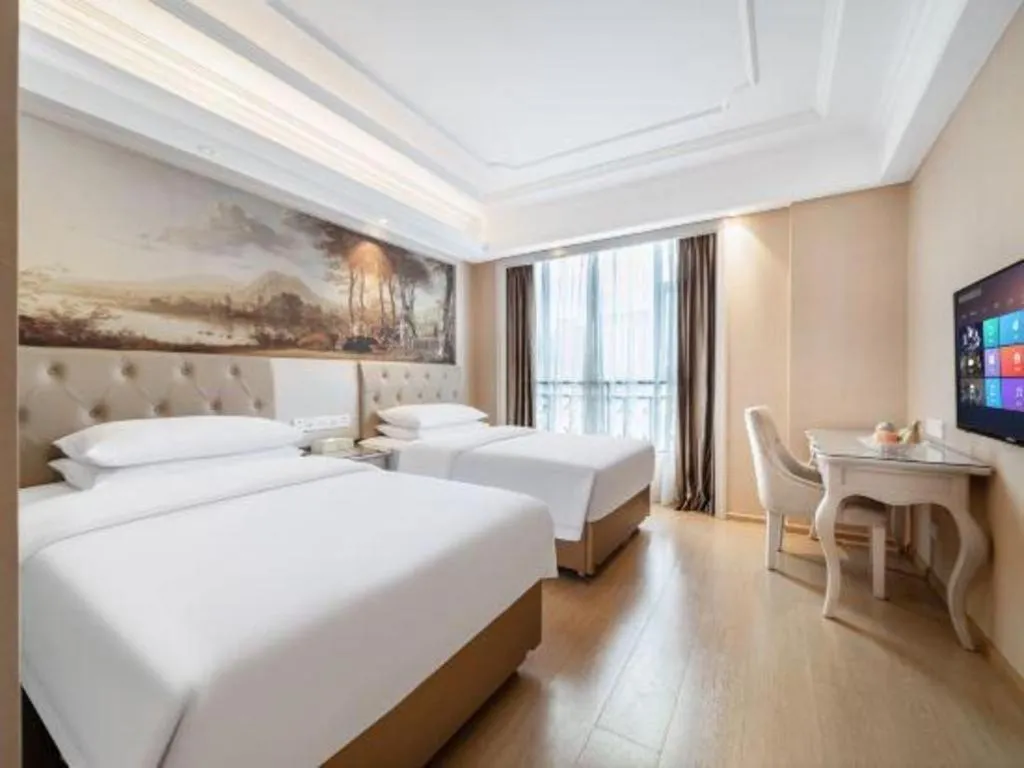 Bed in Vienna Hotel Guiyang Jiaxiulou Jichang Road