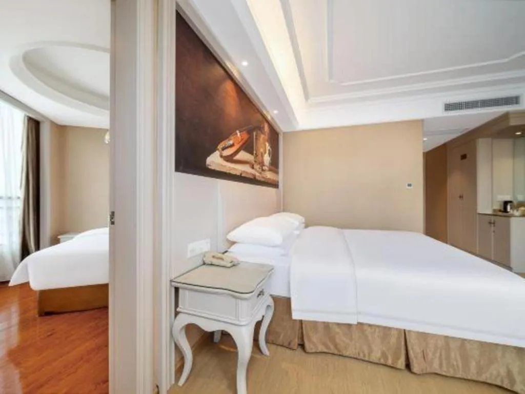 Bed in Vienna Hotel Guiyang Jiaxiulou Jichang Road