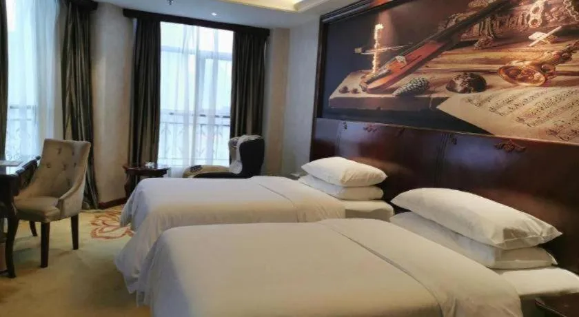Bed in Vienna Hotel Guiyang Jiaxiulou Jichang Road