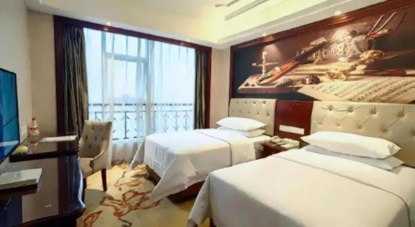 Bed in Vienna Hotel Guiyang Jiaxiulou Jichang Road
