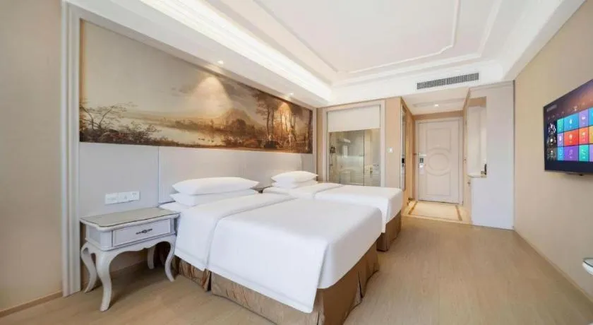 Bed in Vienna Hotel Guiyang Jiaxiulou Jichang Road