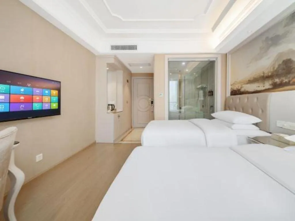 Bed in Vienna Hotel Guiyang Jiaxiulou Jichang Road