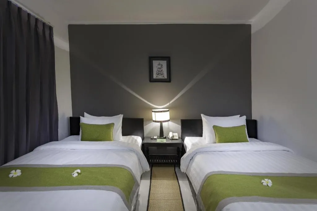 Bed in The Cyclo Siem Reap Hotel