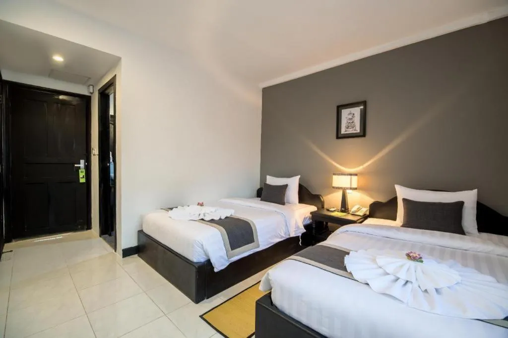 Bed in The Cyclo Siem Reap Hotel