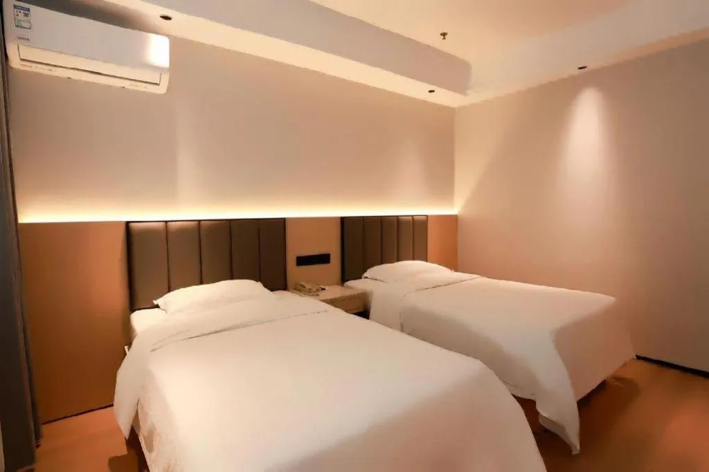 Bed in GreenTree Inn Maanshan Hanshan District Jiuwu Square Hotel