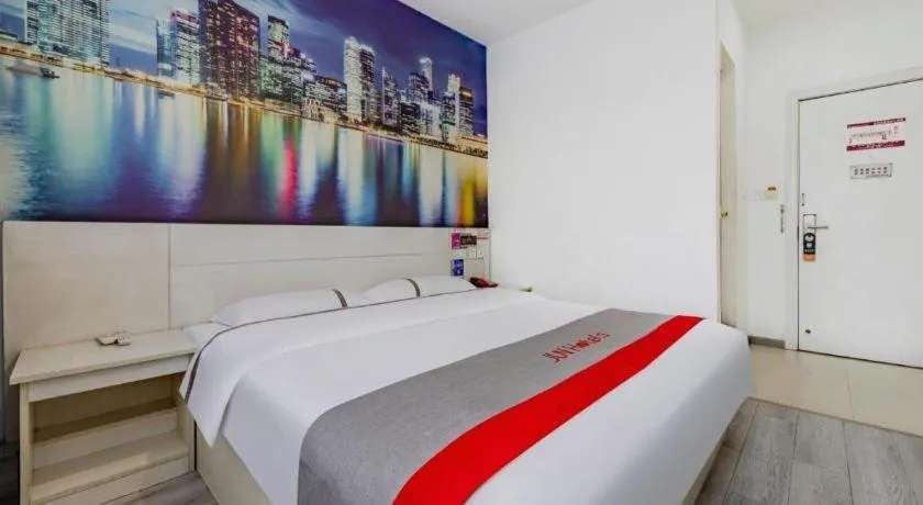 Bed in JUNYI Hotel Jiangxi Xinyu Baoshi Park