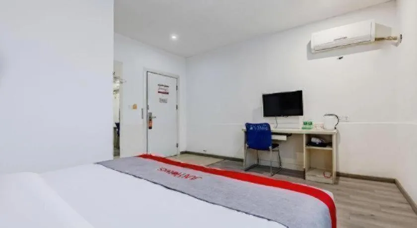 Bed in JUNYI Hotel Jiangxi Xinyu Baoshi Park