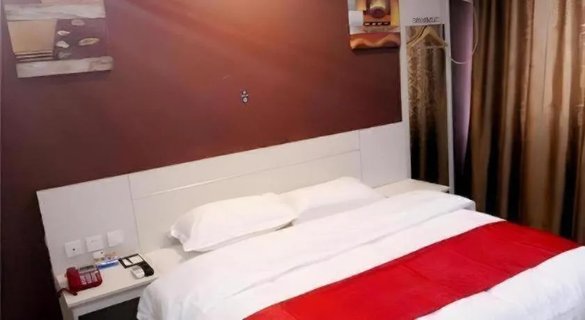 Bed in JUNYI Hotel Jiangxi Xinyu Baoshi Park