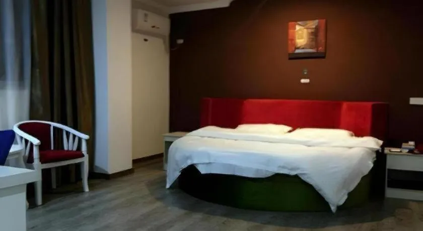 Bed in JUNYI Hotel Jiangxi Xinyu Baoshi Park