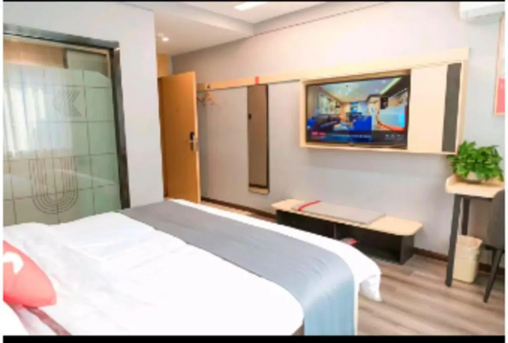 Bed in JUNYI Hotel Jiangxi Xinyu Baoshi Park