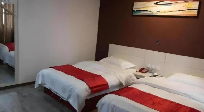 Bed in JUNYI Hotel Jiangxi Xinyu Baoshi Park