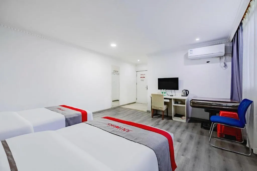 Bed in JUNYI Hotel Jiangxi Xinyu Baoshi Park