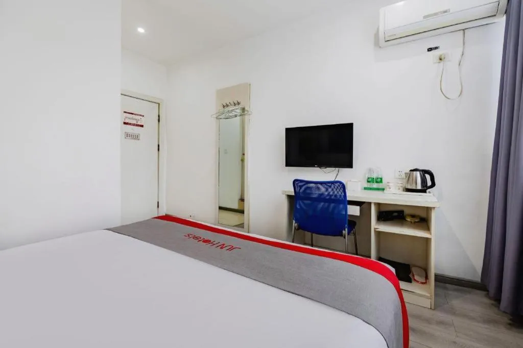 Bed in JUNYI Hotel Jiangxi Xinyu Baoshi Park