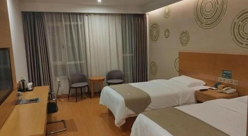 Bed in GreenTree Inn Shandong Heze Caoxian Zhuangzhai Town Oriental Times City Business Hotel