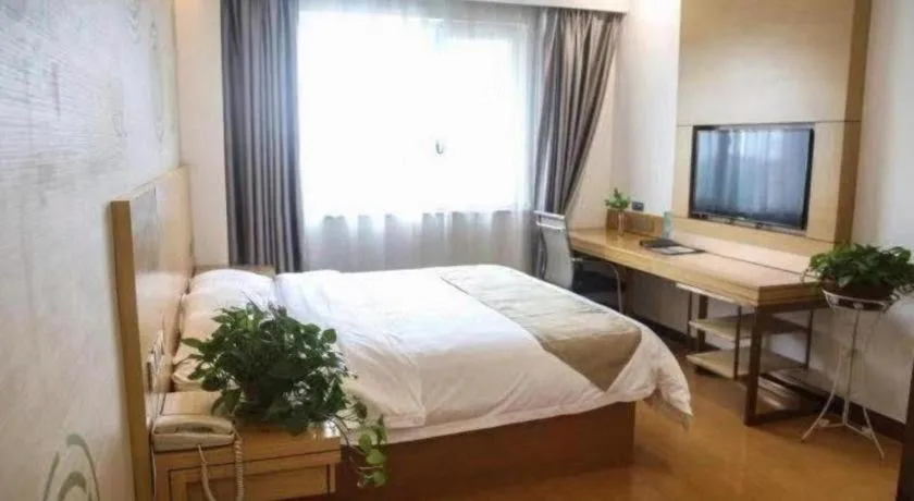 Bed in GreenTree Inn Shandong Heze Caoxian Zhuangzhai Town Oriental Times City Business Hotel